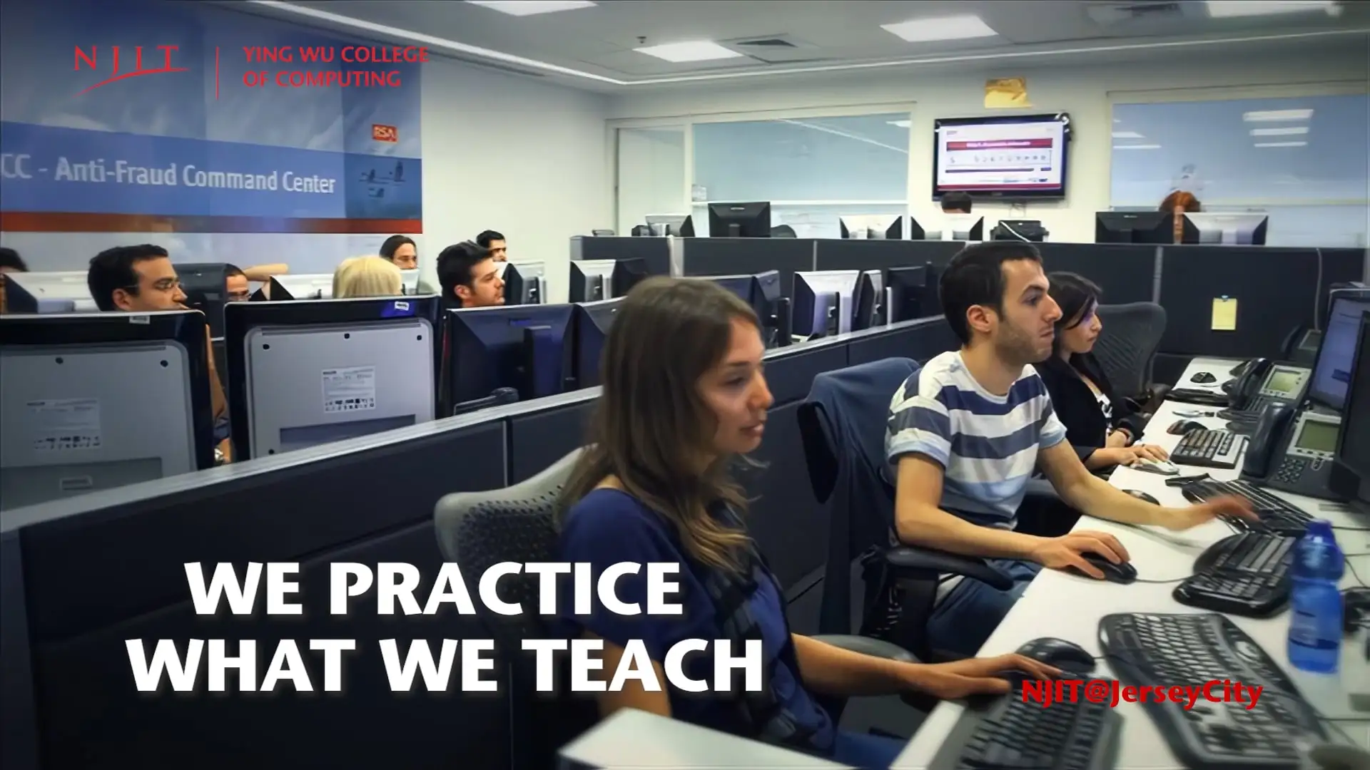 Students in a modern classroom setting with computers