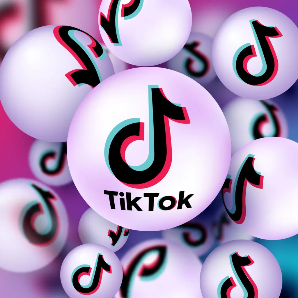 A pink abstract banner with the TikTok logo.